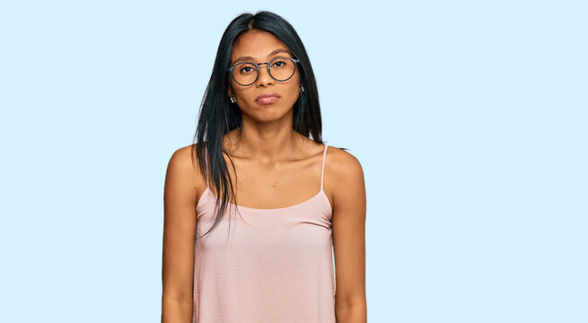 Young african american woman wearing casual clothes and glasses depressed and worry for distress, crying angry and afraid. sad expression.