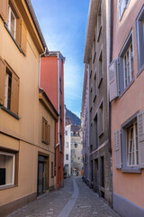 Fototapeta na wymiar Historical narrow street in Chur, considered to be the oldest town in Switzerland and is the capital of the Swiss canton of Graubunden.