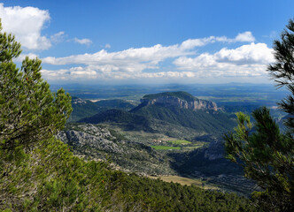 Naklejka premium Spectacular View From The Summit Of Mount L'Ofre To The Mount Puig d'Alaro In The Tramuntana Mountains On Balearic Island Mallorca On A Sunny Winter Day With A Few Clouds In The Sky