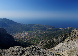 Fototapeta na wymiar Spectacular Sea View From The Summit Of Mount L'Ofre To The Villages Of Soller And Port De Soller In The Tramuntana Mountains On Balearic Island Mallorca On A Sunny Winter Day With A Clear Blue Sky