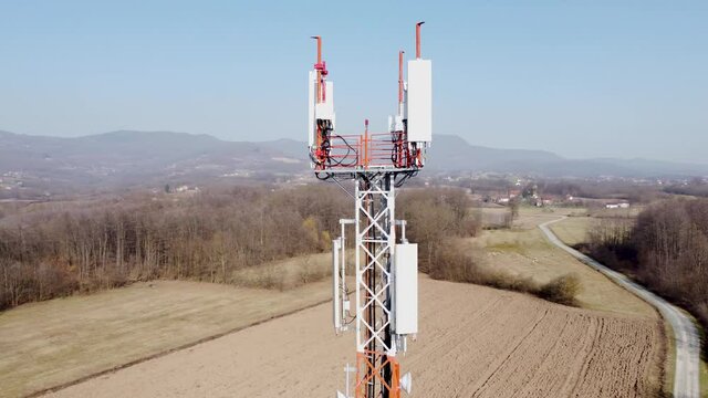Aerial drone view of GSM and radio telecommunication tower. Cell phone tower. Base transceiver station. Wireless communication antenna transmitter.  