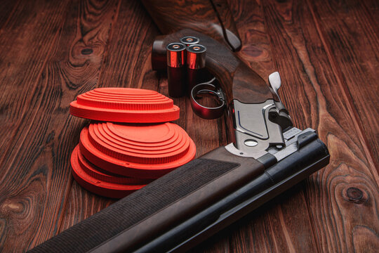 Clay target plates for shooting with rifle on wooden back