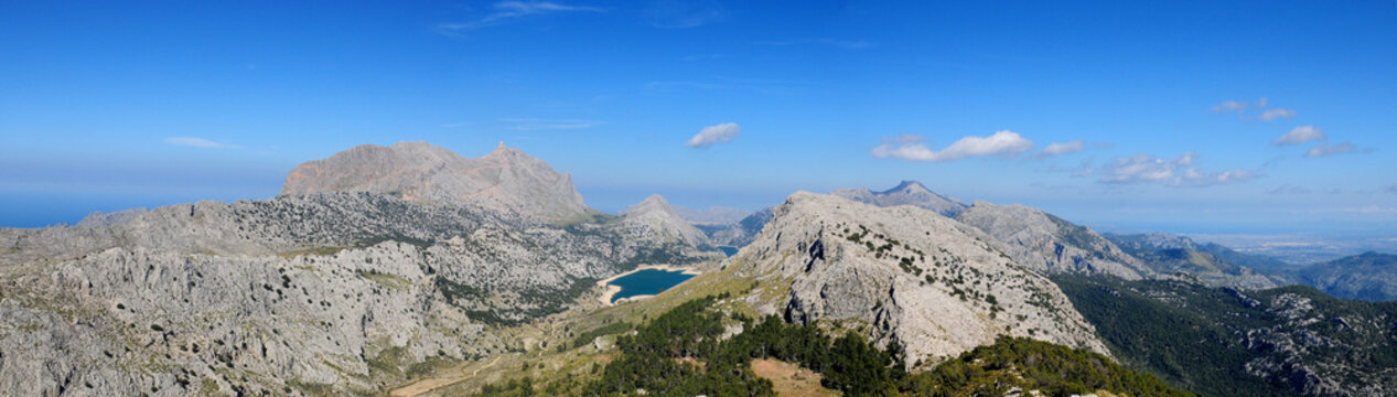 Spectacular Panorama View From The Summit Of Mount L'Ofre To The Puig Major And Lake Cuber In The Tramuntana Mountains On Balearic Island Mallorca On A Sunny Winter Day With A Clear Blue Sky