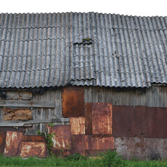 Old aged weathered wooden shack, grey plated wood boarding hut wall, patched planks, rusted metal...
