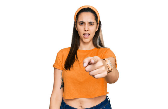 Young hispanic woman wearing casual clothes pointing displeased and frustrated to the camera, angry and furious with you