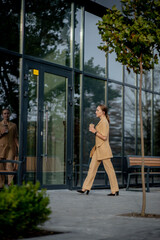 Business Women Style. Woman with Briefcase Going To Work. Portrait Of Beautiful Smiling Female In Stylish Office Clothes. High Resolution.