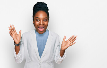 Young african american woman wearing business clothes celebrating crazy and amazed for success with...