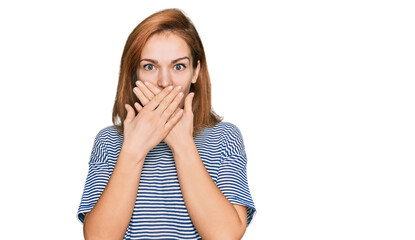 Young caucasian woman wearing casual clothes shocked covering mouth with hands for mistake. secret concept.