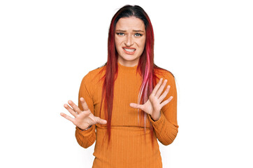 Young caucasian woman wearing casual clothes disgusted expression, displeased and fearful doing...