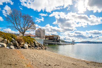 Obraz na płótnie Canvas Winter view of the public beach along Lake Coeur d'Alene with a resort, boardwalk and marina in view in the mountain city of Coeur d'Alene, Idaho USA