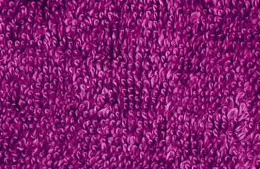 Fluffy luxurious purple towelling texture macro background