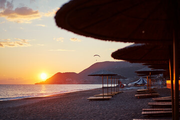 Beautiful landscape. Traveling by Turkey. Sea Beach with sunloungers and umbrellas.