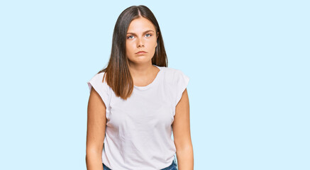 Young caucasian woman wearing casual white tshirt depressed and worry for distress, crying angry and afraid. sad expression.