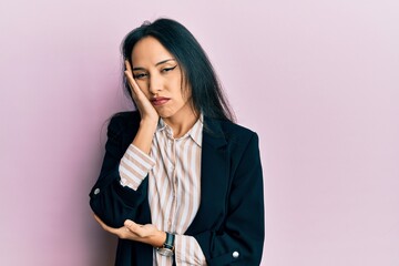 Young hispanic girl wearing business clothes thinking looking tired and bored with depression problems with crossed arms.