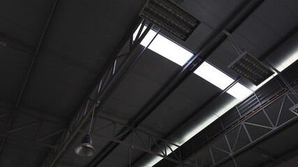 Obraz premium Translucent tiles on the roof. Sunlight shines through the translucent roof sheet in bottom view with a copy area. Selective focus