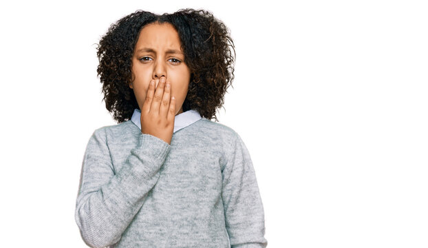 Young little girl with afro hair wearing casual clothes bored yawning tired covering mouth with hand. restless and sleepiness.