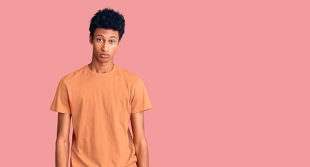 Obraz premium Young african american man wearing casual clothes depressed and worry for distress, crying angry and afraid. sad expression.