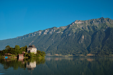 Fototapeta na wymiar Beautiful swiss landscape. Iseltwald vilage on Brienzersee lake.