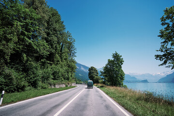 Beautiful landscape with motorway in Switzerland, road next to lake Brienz.