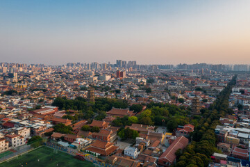 Aerial view of Kaiyuan Temple, the largest buddhist temple in Fujian Province, and West Street at dusk in Quanzhou, China