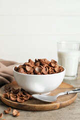 Composition with tasty cornflakes on wooden table