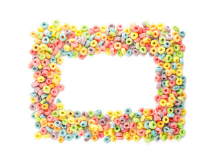 Frame made of tasty cereal rings on white background