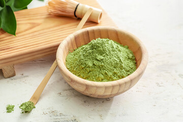 Composition with powdered matcha tea on light background, closeup