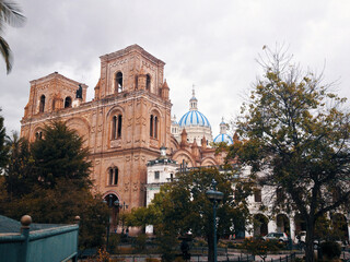 Fototapeta na wymiar Iconic and beautiful church San Sebastián in the old town of Cuenca, Ecuador.