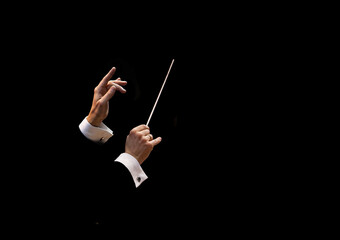 Conductor's hands on a black background - obrazy, fototapety, plakaty