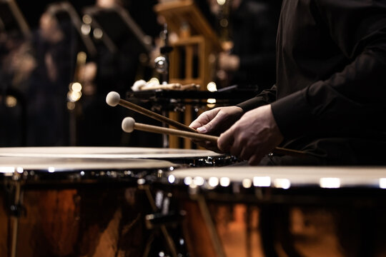 Hands of a musician playing the timpani