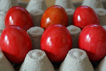Red Colored Easter Eggs In An Egg Carton