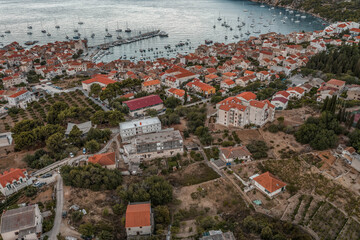 Aerial drone shot of adriatic sea Komiza town on Vis Island in Croatia summer sunrise