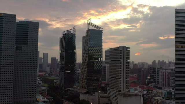 sunset sky singapore city famous downtown modern towers aerial panorama 4k 