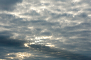 White cloud flying on blue sky with warm color sunlight as texture and background