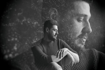 A mystical portrait of a young man. Soul and body. double exposure. black and white photo