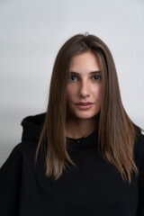 Fototapeta premium portrait of a beautiful girl on a white background close up