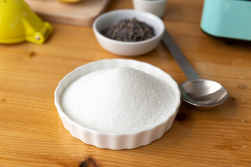 Fototapeta na wymiar Sugar in white bowl for cooking