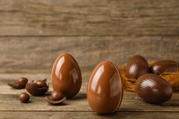 Chocolate Easter eggs on wooden background