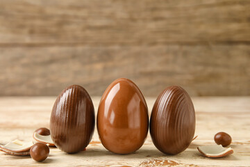 Chocolate Easter eggs on wooden background