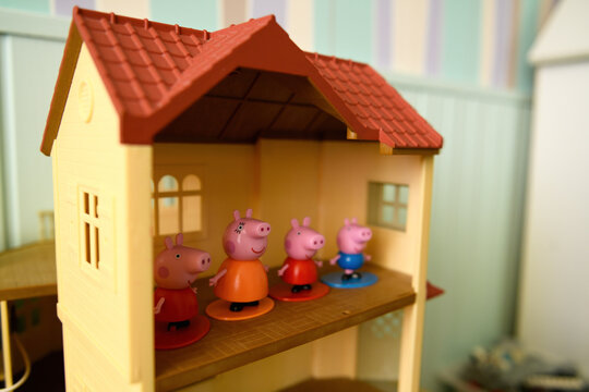 Kazakhstan, Almaty - November 16, 2020: Peppa pig toy, happy family and their home.