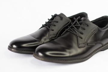 black classic men's shoes on a white background