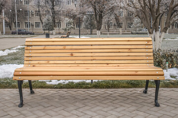 Wooden bench in the city park.