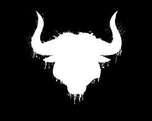 White silhouette of a bull head with horns with paint splashes, splatters and blots isolated on a black background.