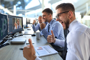 Happy business people laugh near talking in video conference about global bitcoin price.