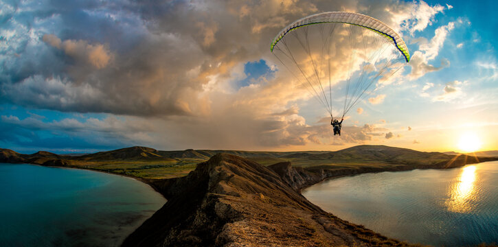 paraglider pilot fly in sky on beauty nature mountain and sea landscape