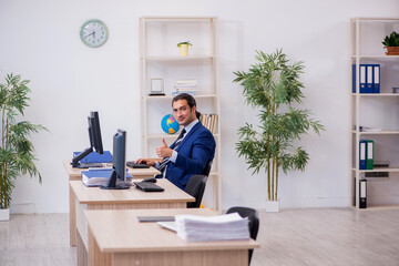 Young male employee working in the office