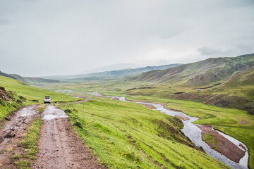 dirt road among the mountains. road in the steppe and mountains