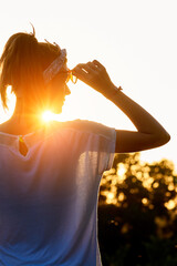 Fototapeta na wymiar Silhouette of a woman in sunset sunrise time.