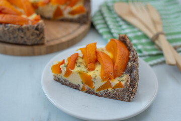 home made pumpkin quiche lorraine on a table