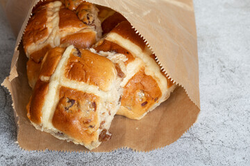 Hot cross buns in a brown paper bag.  Recycling environmentally friendly packaging concept